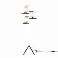 Modern decorative floor lamp with three frosted glass shades and black metal base